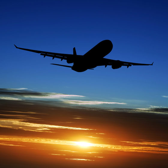 commercial jet silhouette in an evening sky